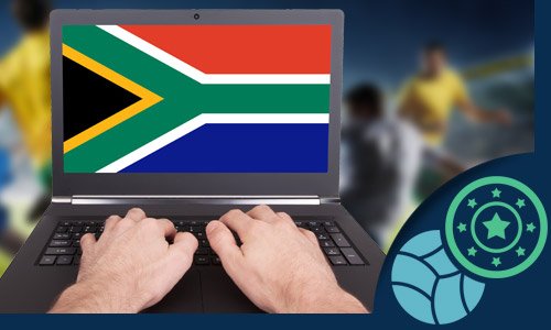 hands working on a laptop with the South African flag on the screen