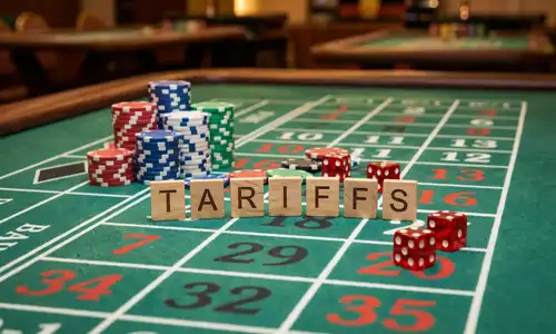 A photograph of casino chips, dice and wooden tiles spelling tariffs on a green felt table with betting layout background