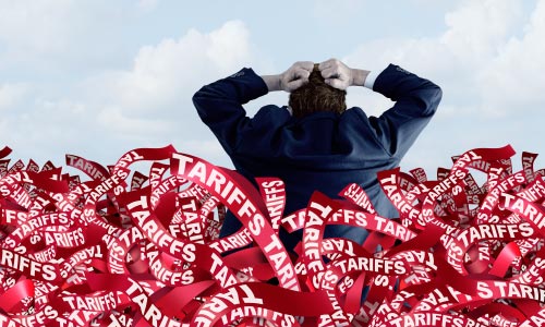 A photo of a man in a suit tearing his hair out, drowning in a sea of red ribbons with the word tariffs in white printed on each