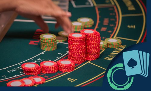 baccarat dealer arranging the chips on a baccarat table