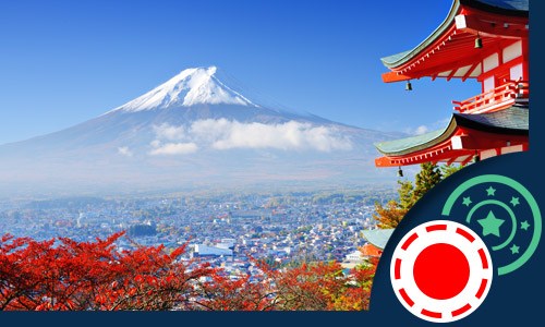 Japanese traditional building with cherry blossoms and Mt. Fuji in the distance