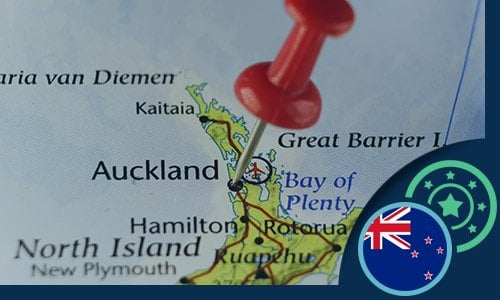 map of New Zealand with a stick pin in Auckland